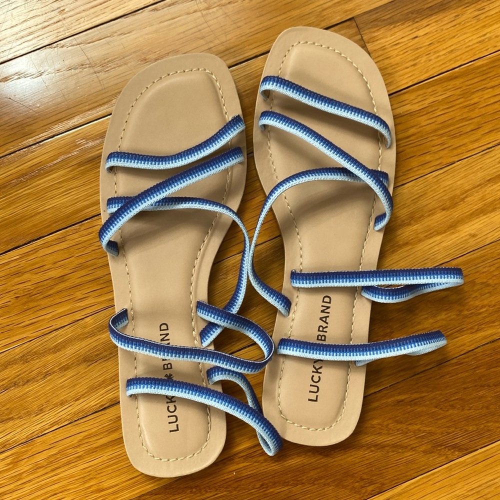 Lucky brand like new size 8.5 sandals worn one time . Blue bands across the top